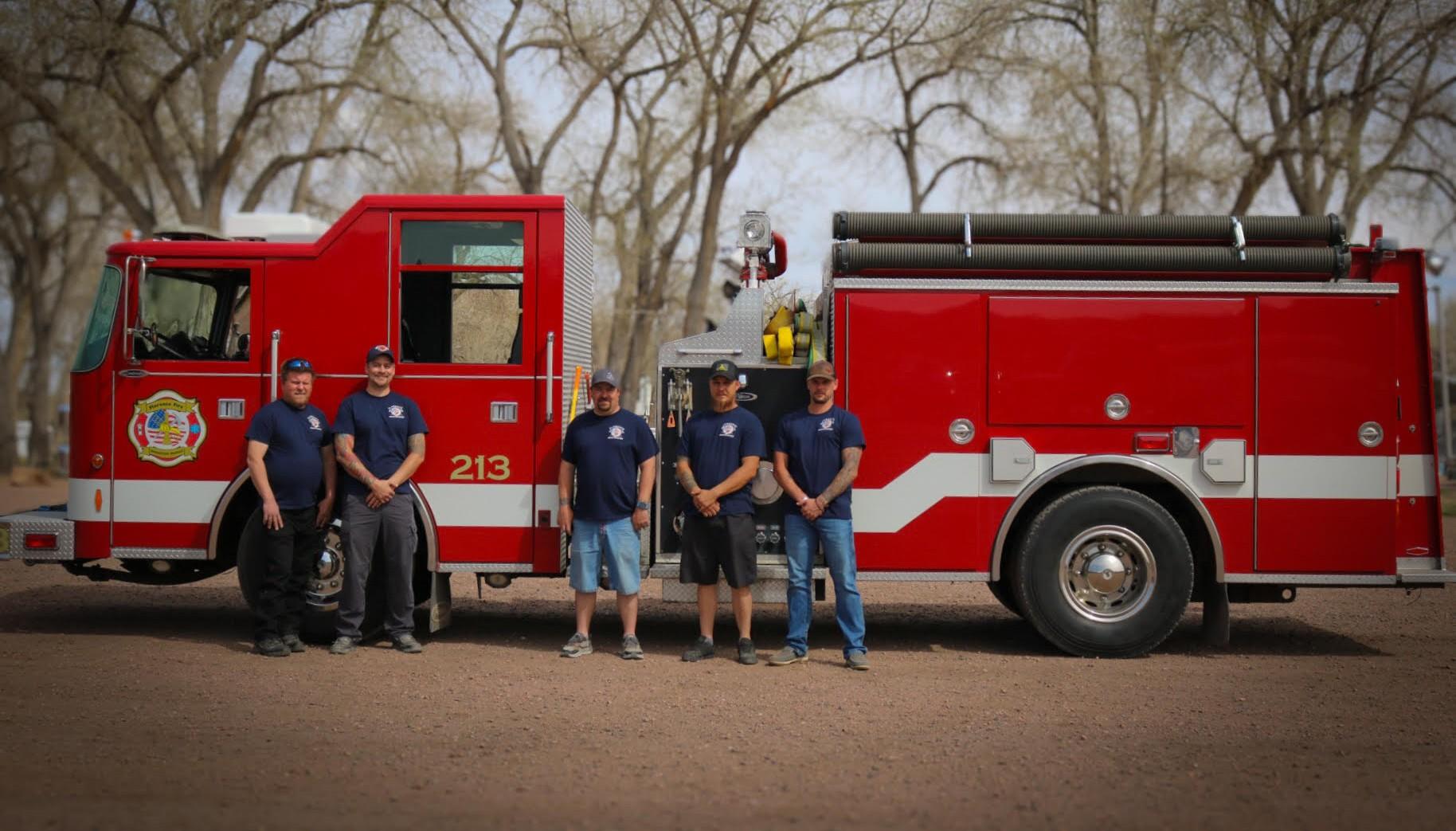 5 FFPD Firefighters in front of truck