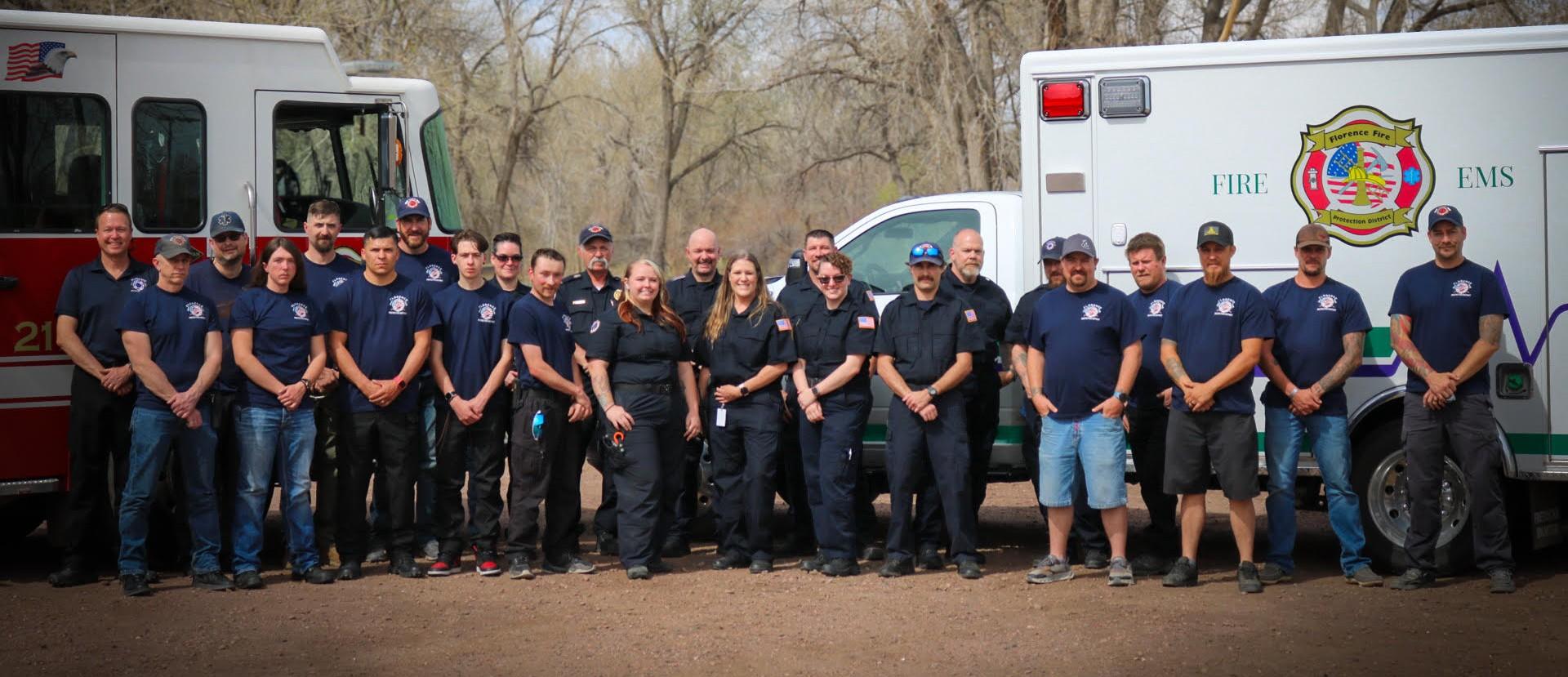 FFPD Fire and EMS crews in front of fire truck and ambulance