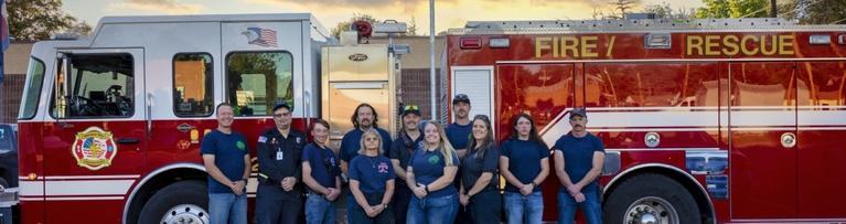 FFPD volunteers in front of fire engine